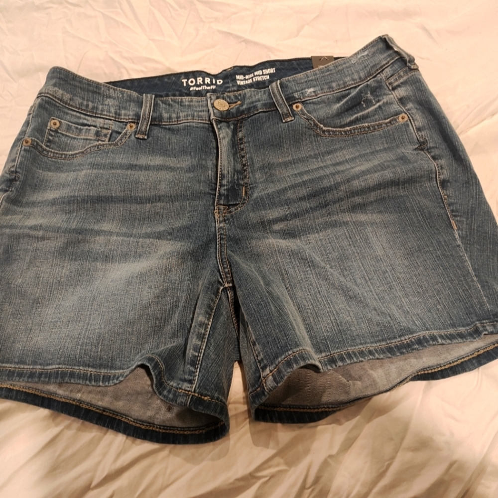 Torrid Blue Jean Shorts with Raw Hem and Distressed Look